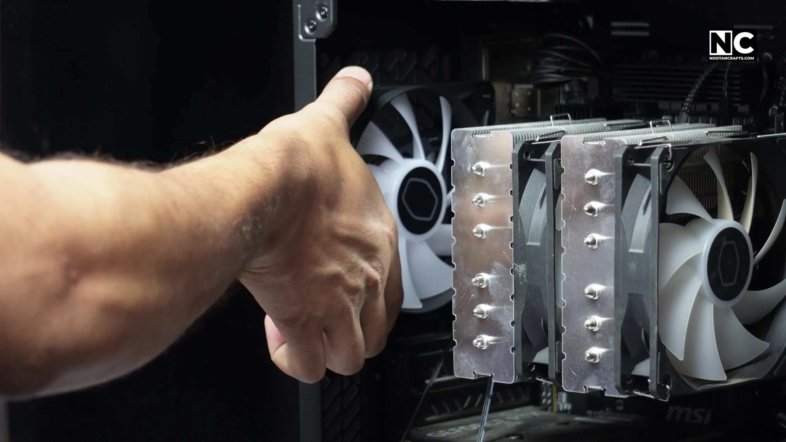 CF120 fan held against the rear exhaust mount of the case
