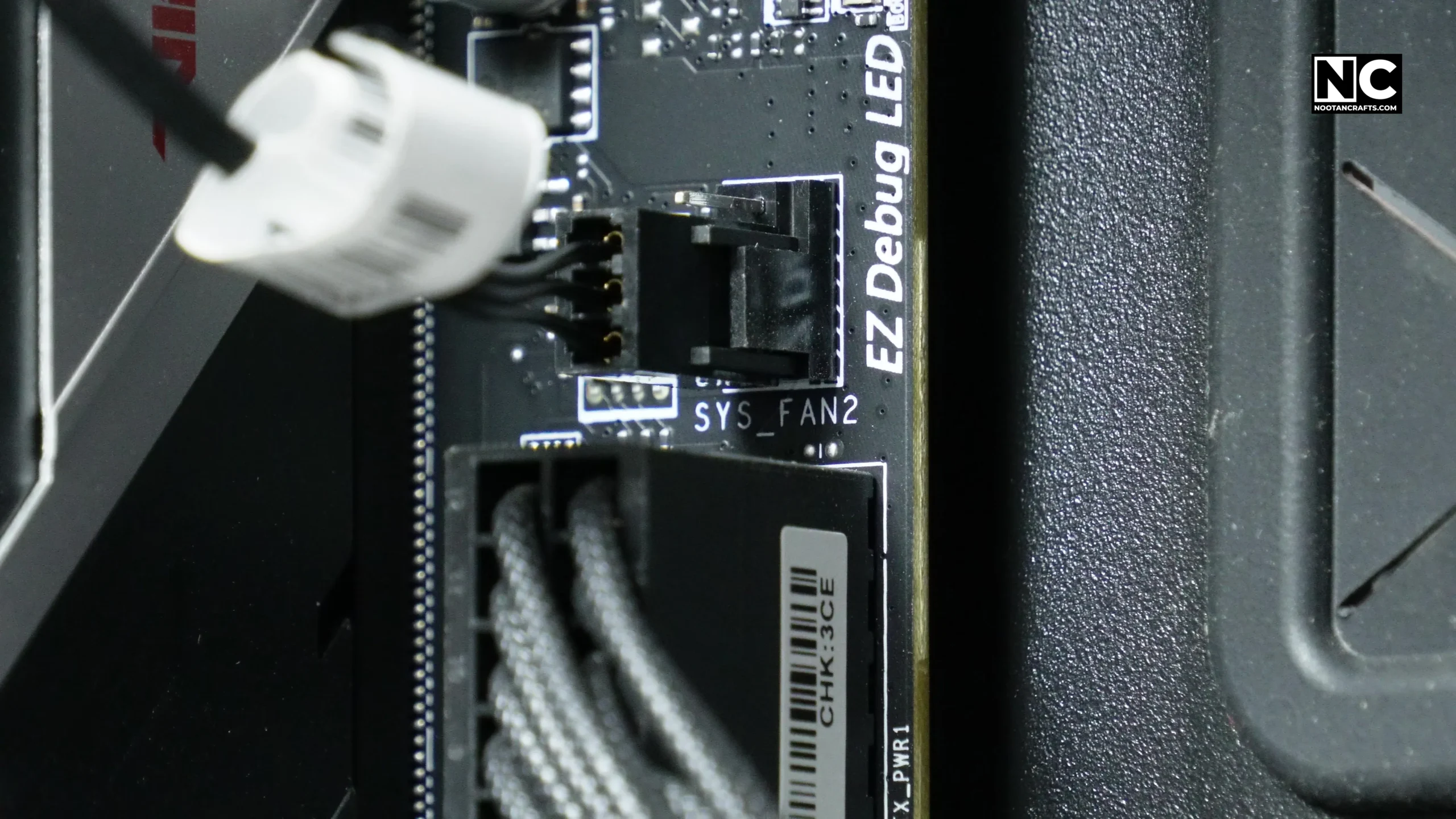 Connecting the CF120 fan power lead to a chassis fan header on the motherboard