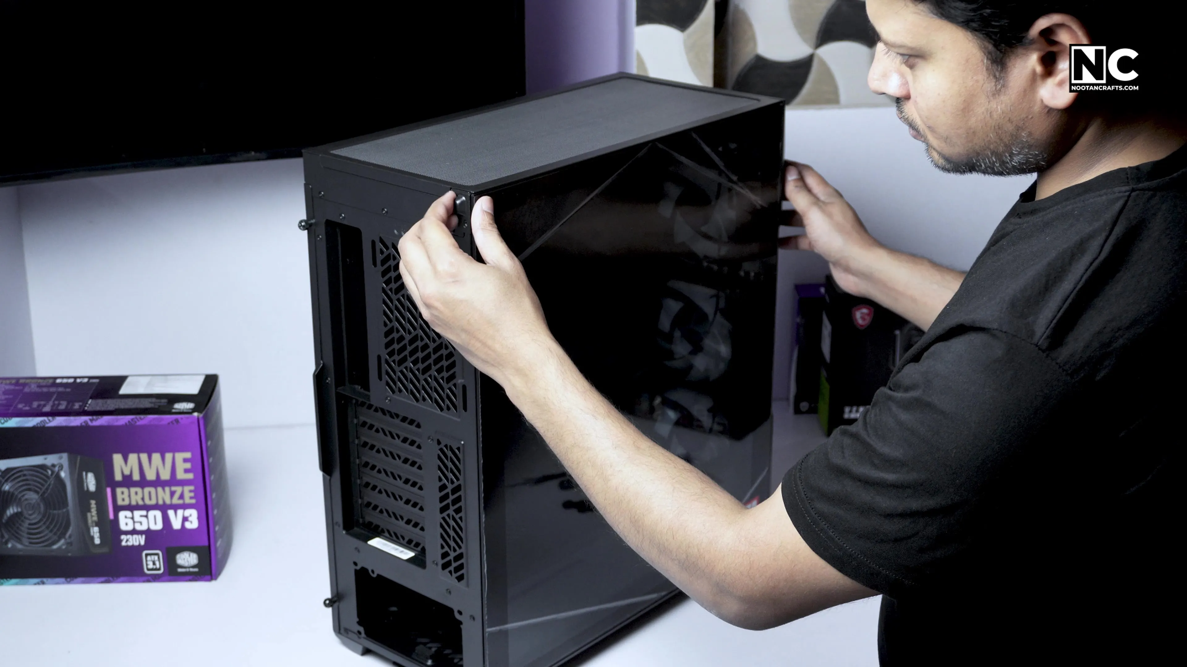 Removing the tempered glass side panel from the case