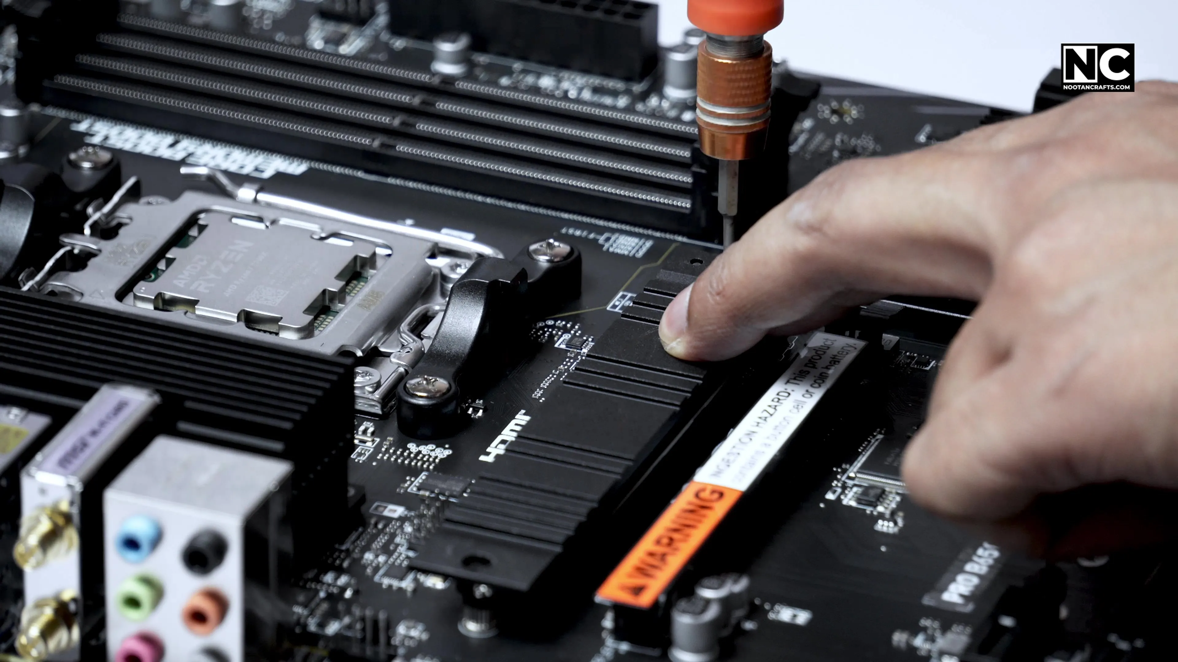 Securing the M.2 heatsink over the installed SSD