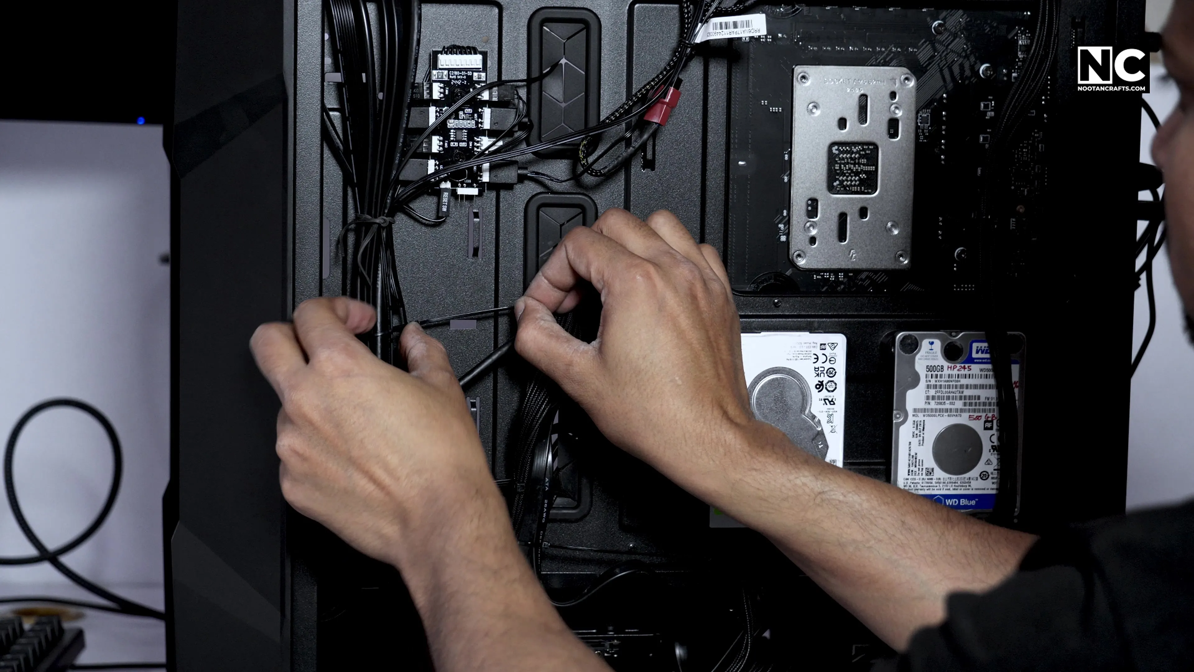 Cable management using nylon cable ties behind the motherboard tray