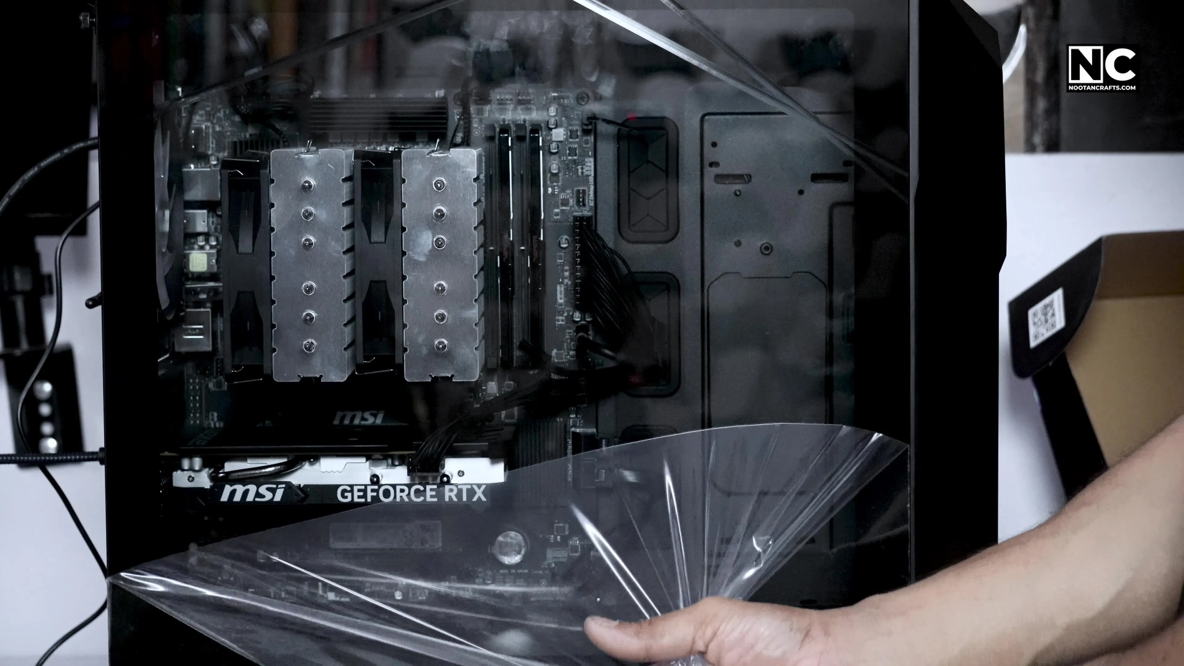 Peeling the protective film from the tempered glass panel