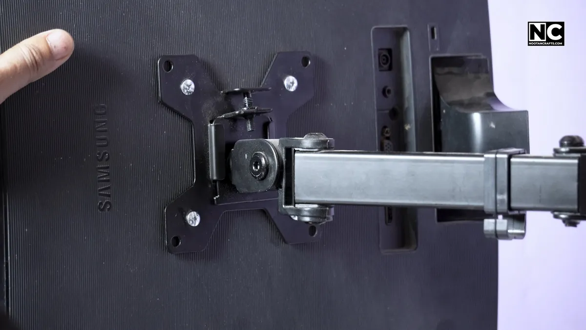 Attaching the monitor to the arm and locking it in place
