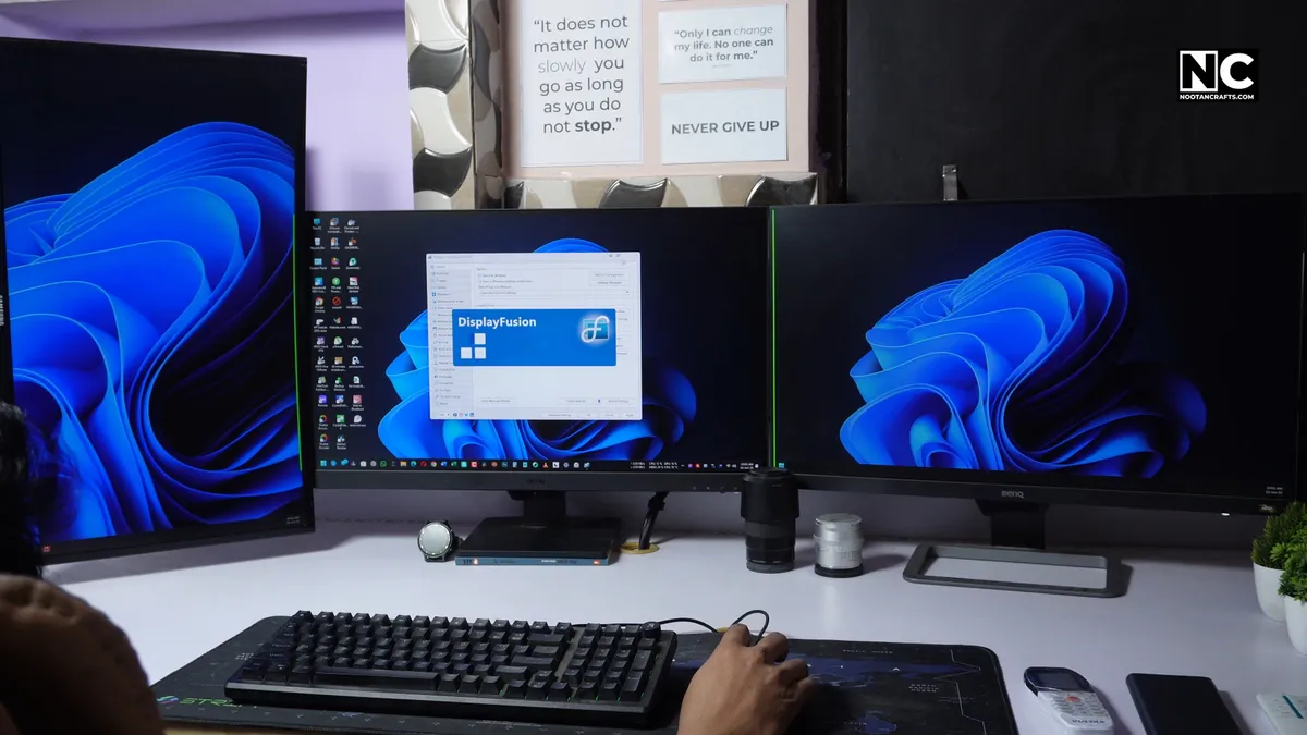 Finished desk with a vertical monitor alongside two horizontal monitors