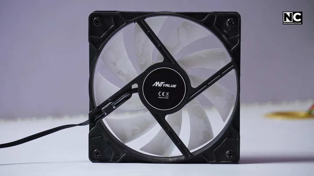 The strut side of a case fan with the motor hub and support bars, which is the exhaust side