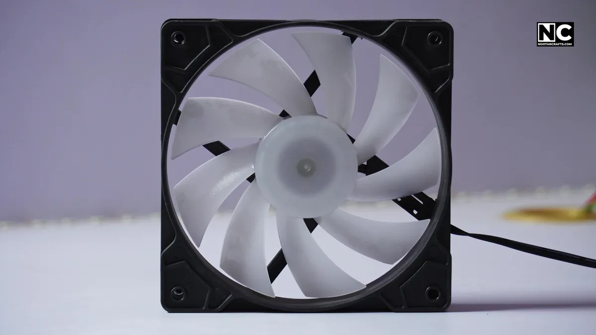 The clean open blade face of a case fan, which is the intake side