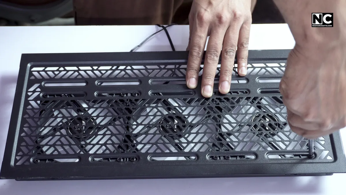 Mounting a case fan to the top panel grill of a PC case